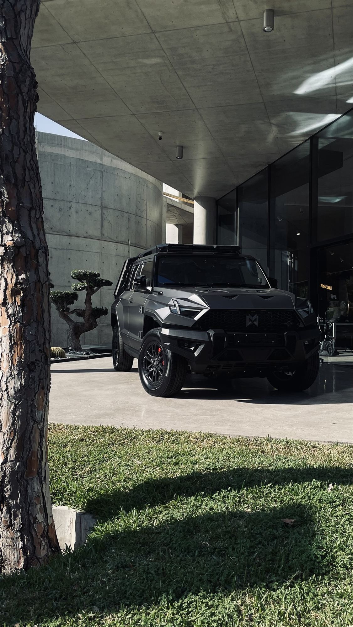 MHERO 1 in matte black outside the Monza SAL showroom